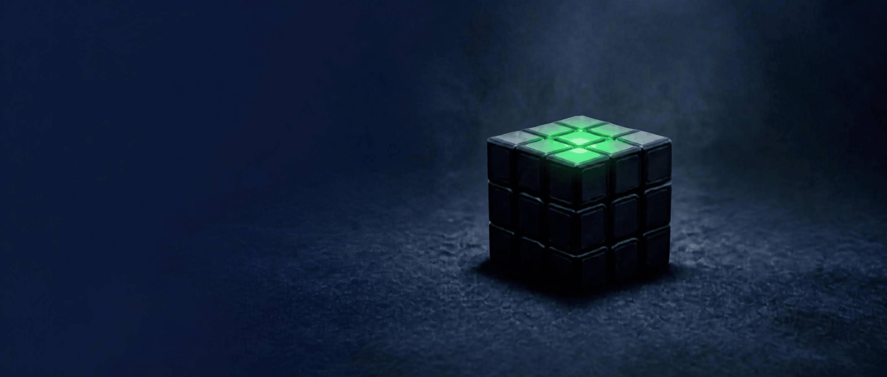 an image of a black cube with only the top face highlighting green