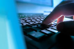 Someone typing on a keyboard.