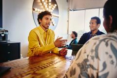 man explaining something during a meeting