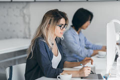 female working on computer at her desk