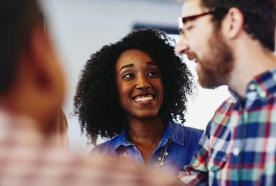 happy woman talking to 2 men