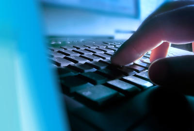 Someone typing on a keyboard.