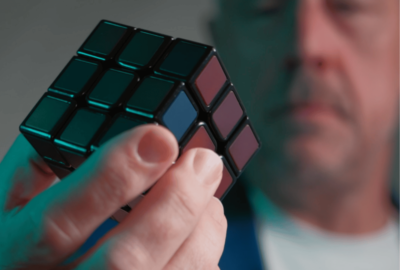 man holding cube